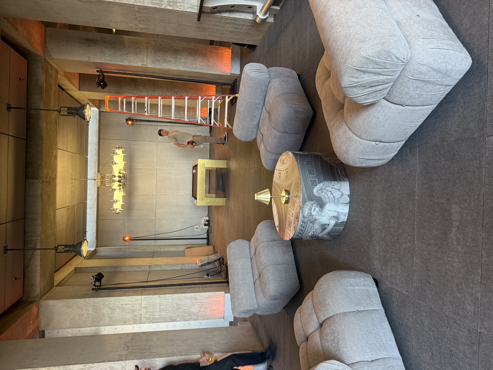 Interior lounge area with large display screen and ambient lighting