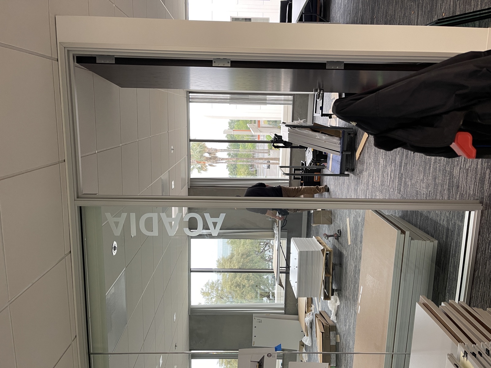 Corporate branded frosted glass at office entrance