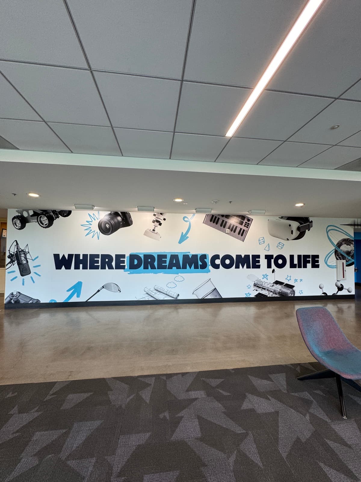 Where Dreams Come to Life wall banner with illustrated STEM objects