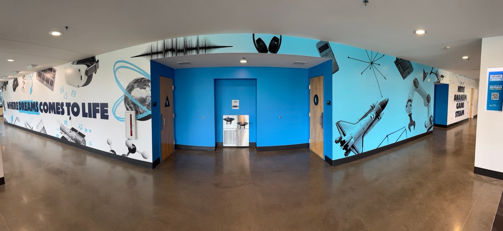 Panoramic wall mural with Where Dreams Comes to Life and STEM imagery